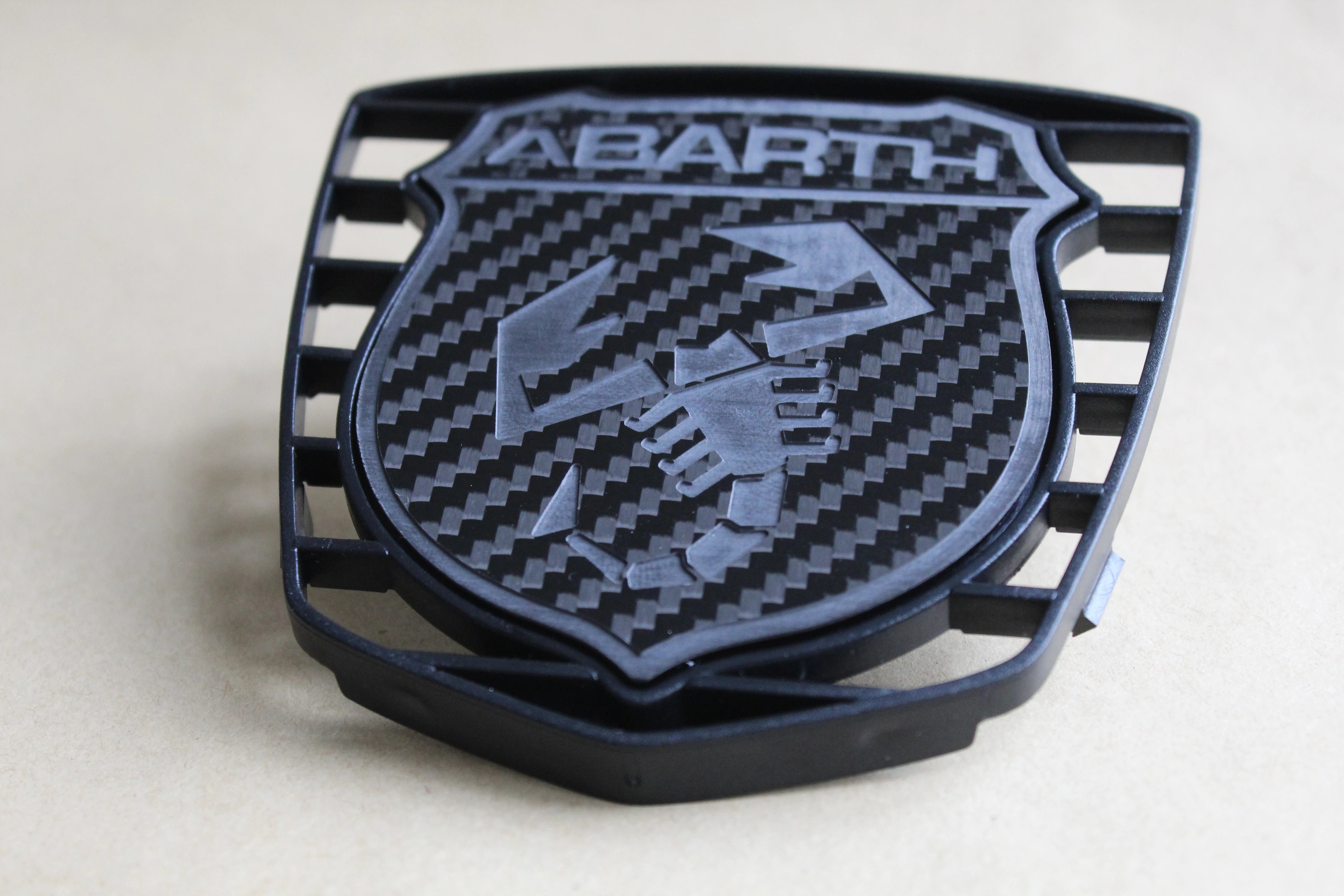 Abarth store front badge